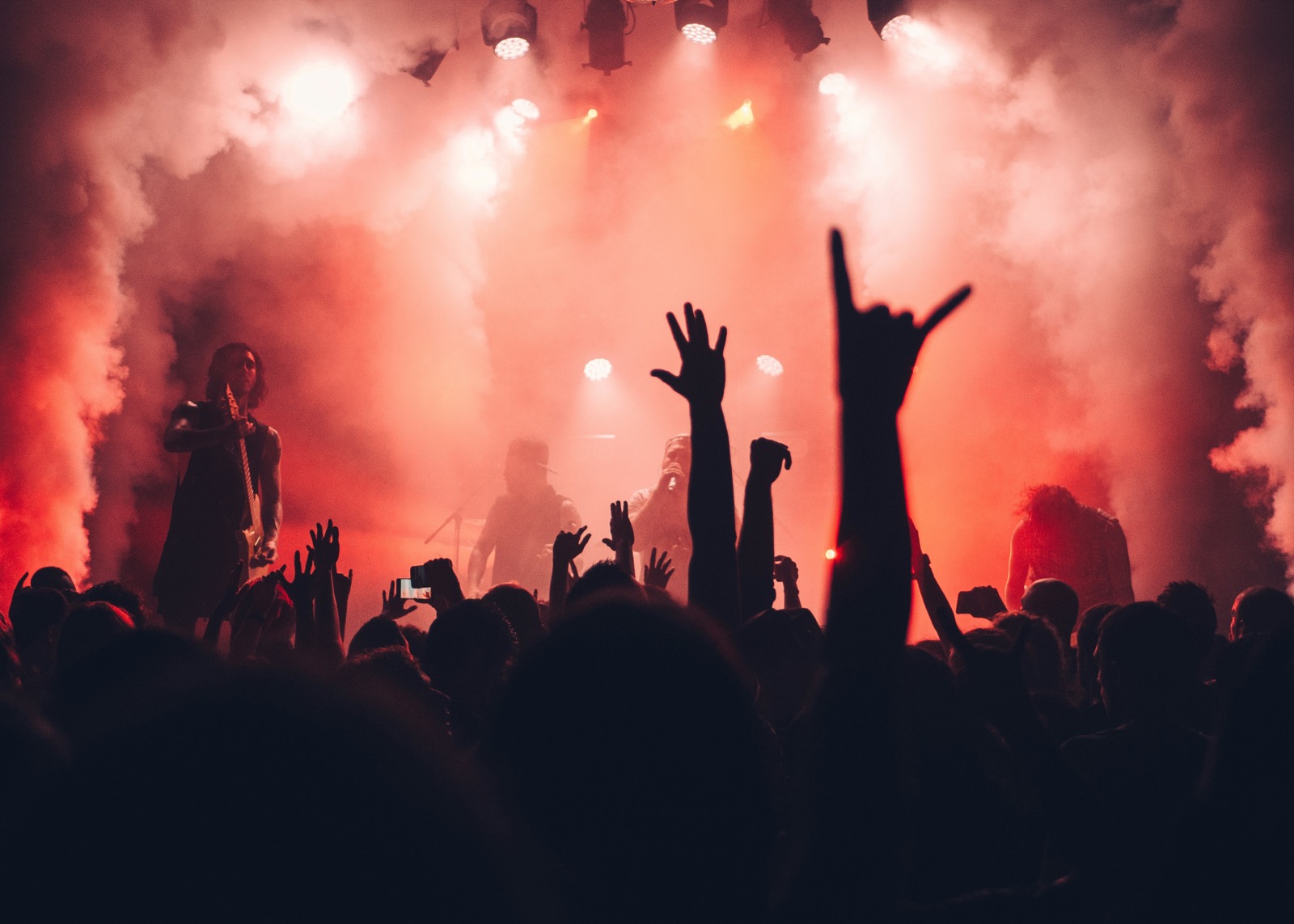 A crowd lit in warm stage light at a Fankee show
